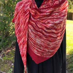 Wrap hand knitted in soft merino wool.